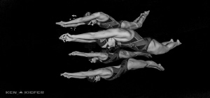 Swimmers streamlining like dolphins by Ken Kiefer 